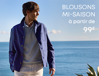 Homme portant un blouson mi-saison devant la mer